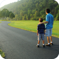 image of man and child walking together. 